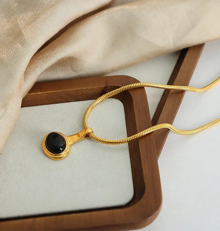 Gold-plated titanium steel necklace featuring a geometric micro glass bead Jewelry Europe Wholesale