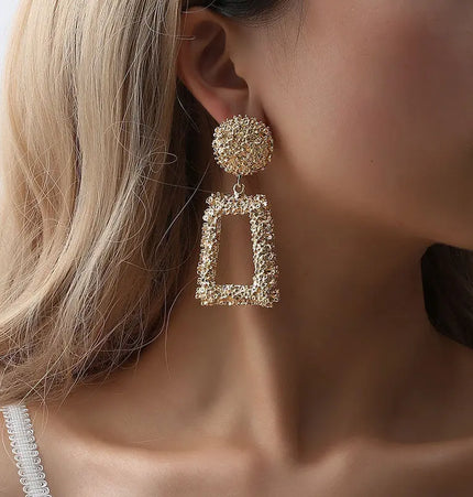 Bold geometric matte gold earrings null