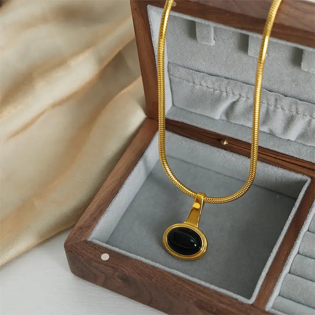 Gold-plated titanium steel necklace featuring a geometric micro glass bead Jewelry Europe Wholesale